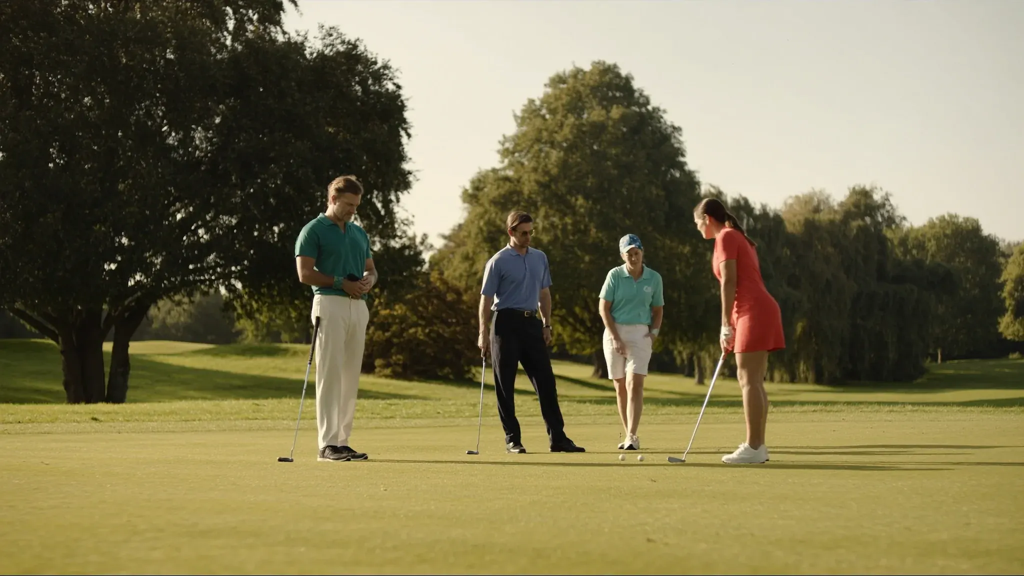 A fourball of members on the putting green